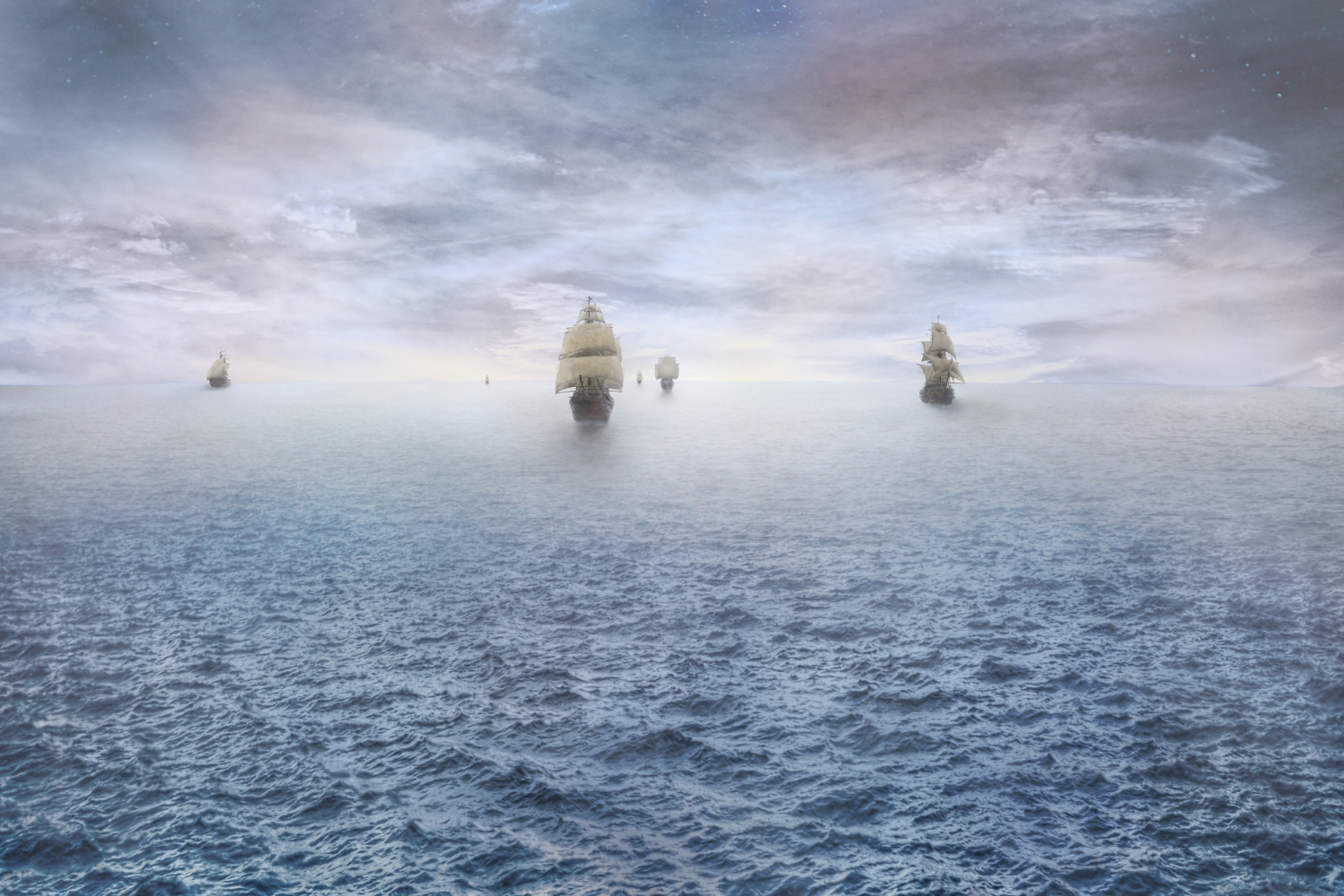 fleet of distant wooden sailing ships at sea